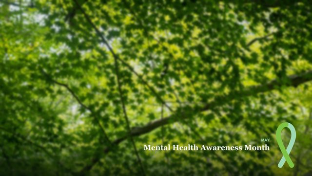 Green canopy photo background with the words Mental Health Awareness Month and a green ribbon